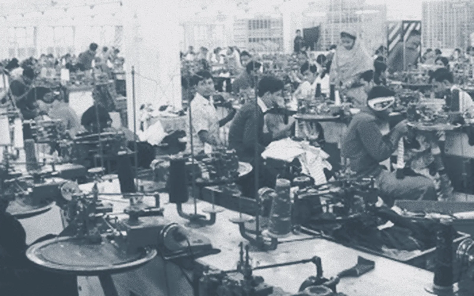 Operators at dial linking machines on the linking floor